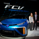 Engineer Jackie Birdsall (far right) stands with senior engineer Jared Farnsworth and engineer Andrea Lubawy at the 2014 Consumer Electronics Show, where the automaker showed the Fuel Cell Vehicle, later named Mirai.